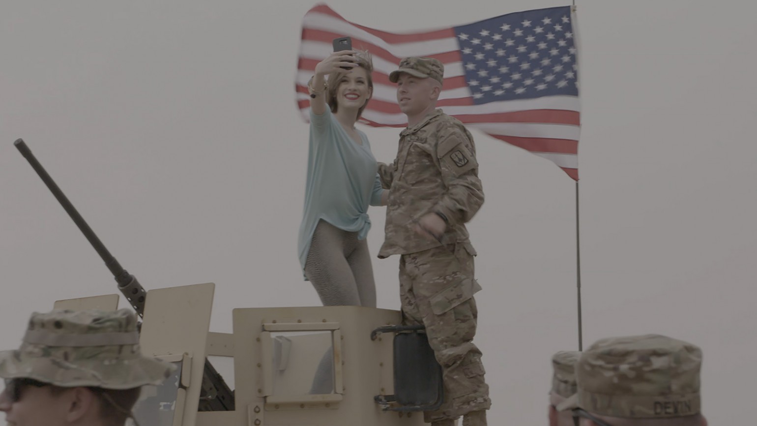 Miss America takes a selfie with a soldier in Kuwait.