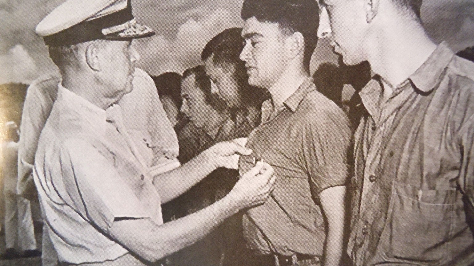 Admiral Spruance presenting the surviving crew members with the Purple Heart. Photo courtesy of Alfred J. Sedivi Collection - USNI.