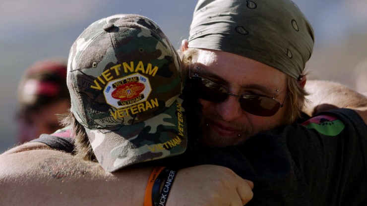 U.S. Marine Corps Veteran, Kenny Toone, embracing a comrade. Photo courtesy of Creative Chaos VMG.
